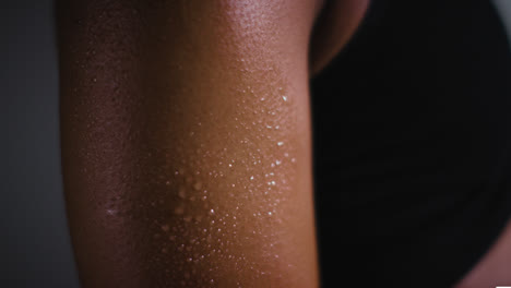 Close-Up-Shot-Of-Beads-Of-Sweat-On-Woman-Wearing-Gym-Fitness-Clothing-Exercising-3